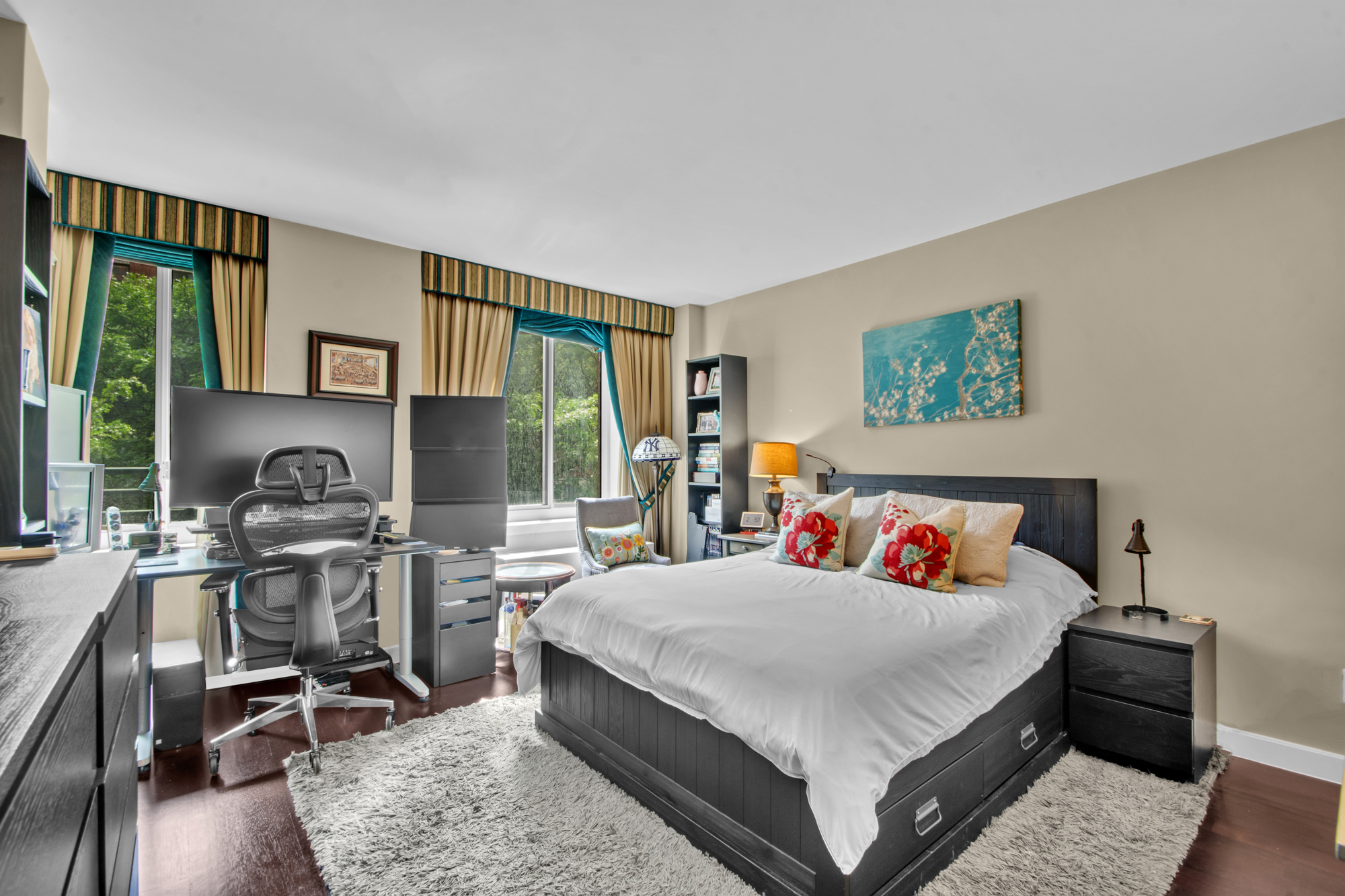 333 Rector Place, Unit 408 Manhattan, NY 10280 - Photo 4 of 12 a bedroom with a bed and wooden floor