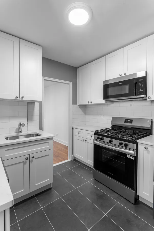 a kitchen with a stove and a sink