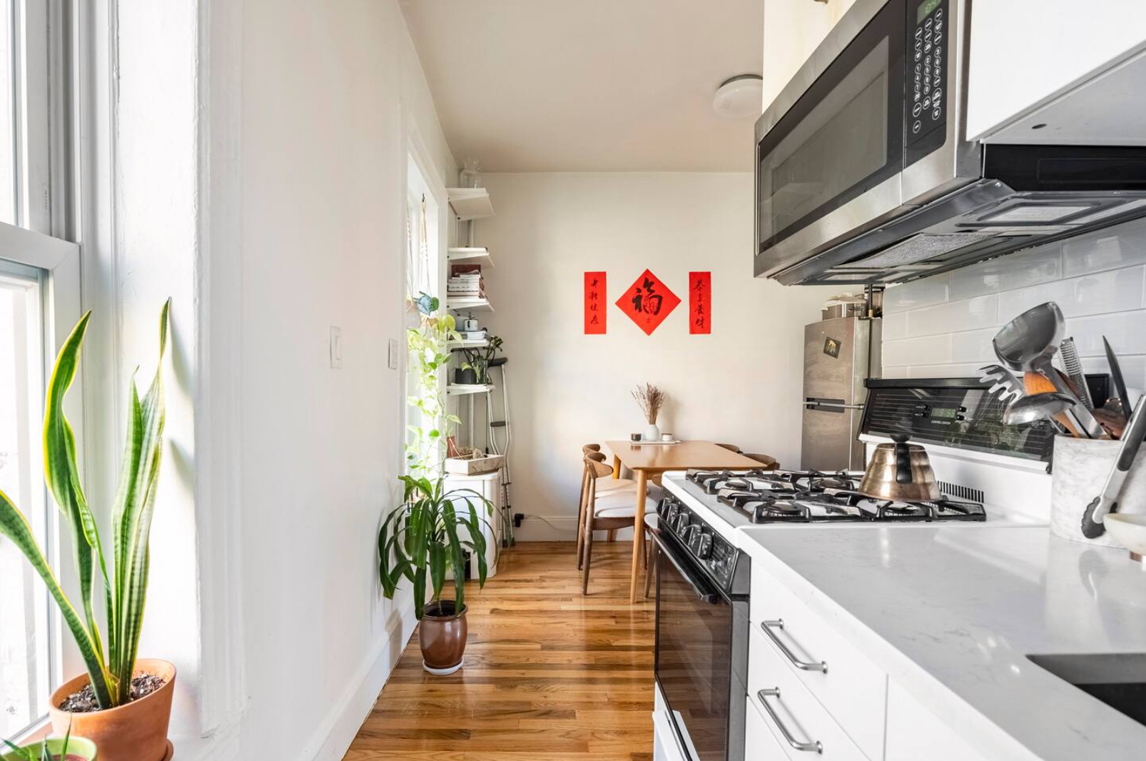 85 Bergen Street, Unit B2 Brooklyn, NY 11201 - Photo 6 of 10 a kitchen with stainless steel appliances granite countertop a sink a stove and a wooden floor