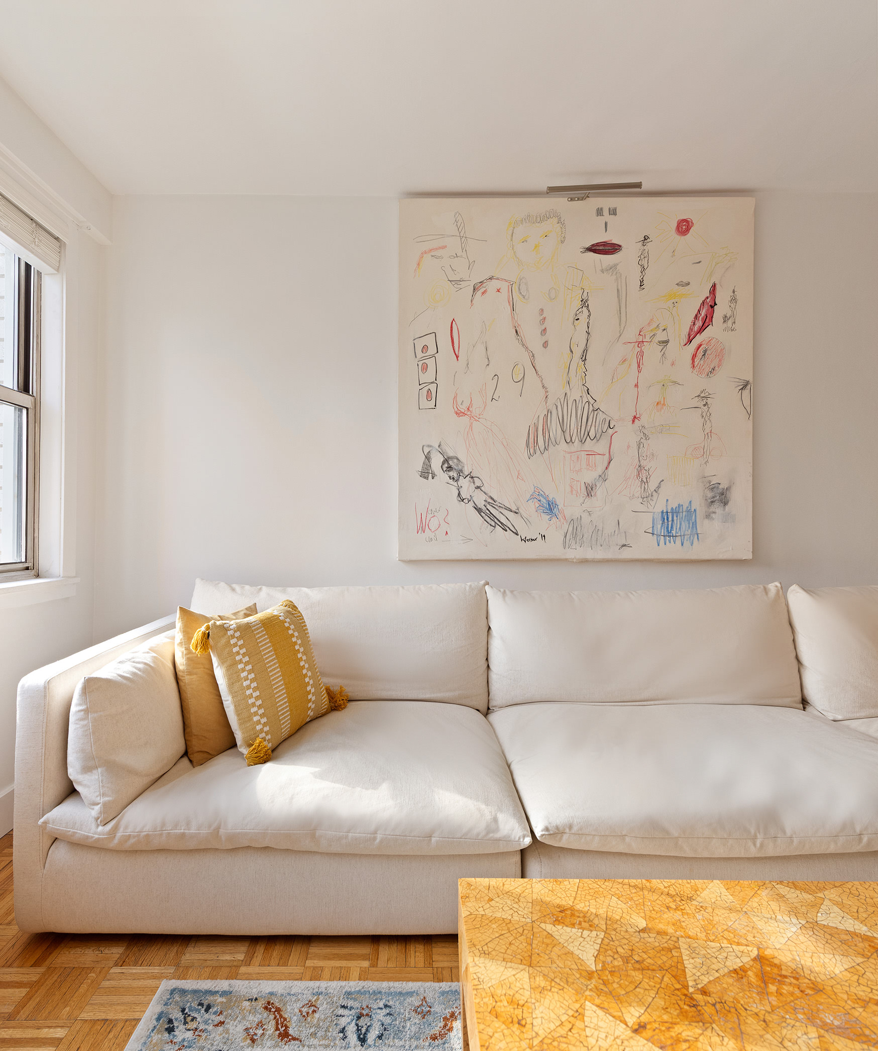 525 East 82nd Street, Unit 12E Manhattan, NY 10028 - Photo 6 of 29 a living room with a couch