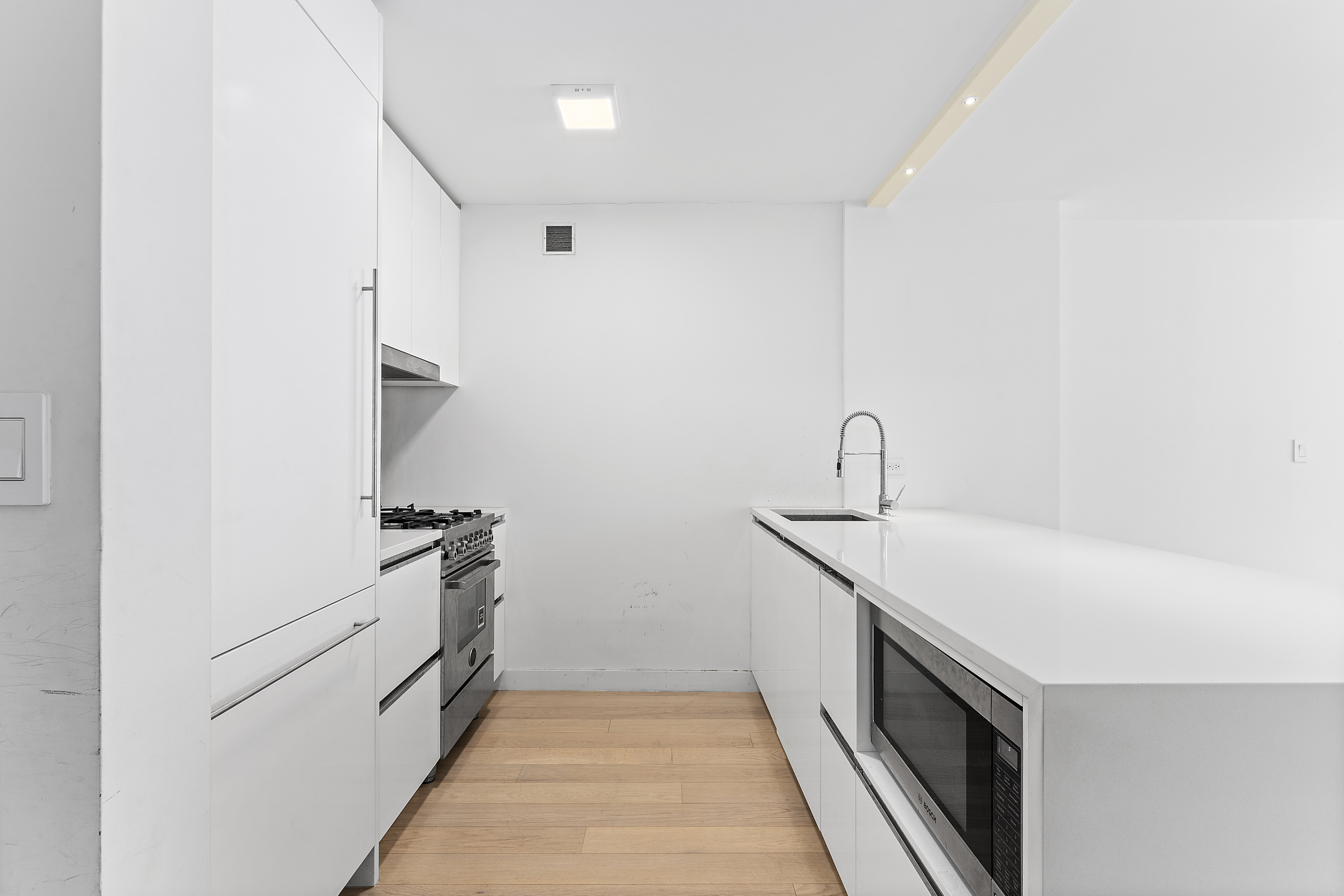 301 West 53rd Street, Unit 8J Manhattan, NY 10019 - Photo 3 of 14 a kitchen with a sink and cabinets