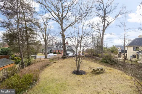 a view of a yard covered in snow