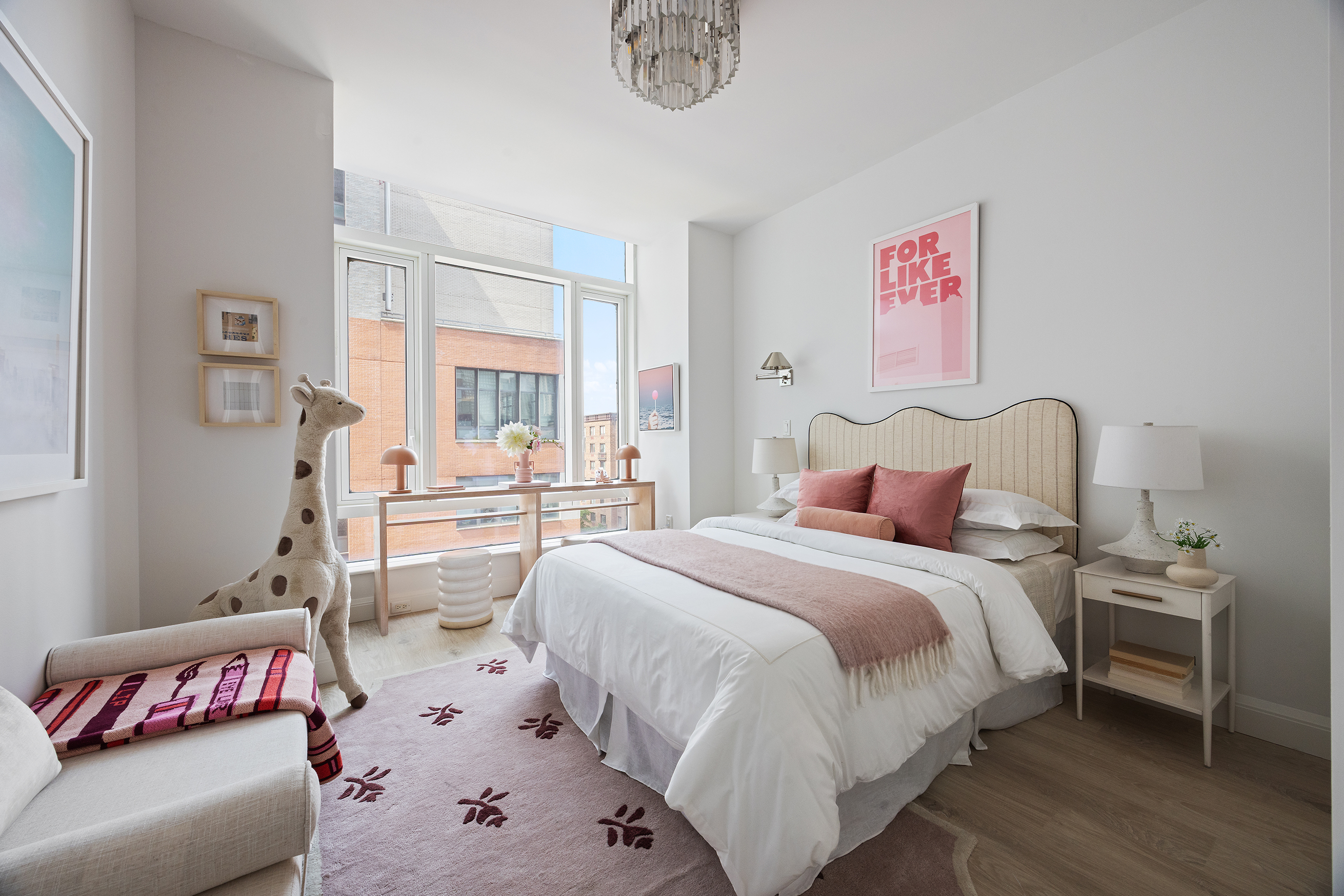 70 Little West Street, Unit 7L Manhattan, NY 10004 - Photo 20 of 25 a bedroom with a bed and a couch