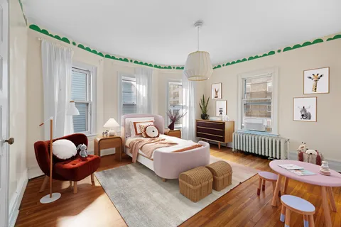 a spacious bedroom with a bed and a chandelier