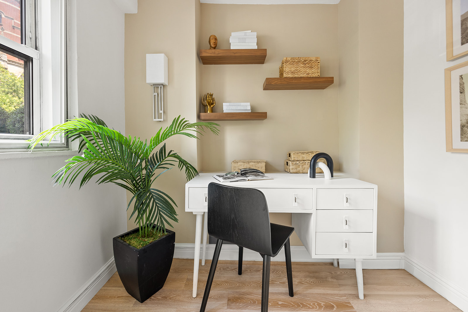 69 West 9th Street, Unit 2B Manhattan, NY 10011 - Photo 14 of 18 a living room with furniture and a potted plant