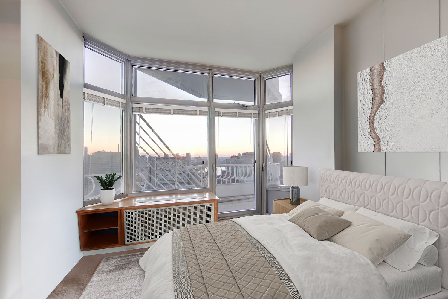 a bedroom with a bed and a large window