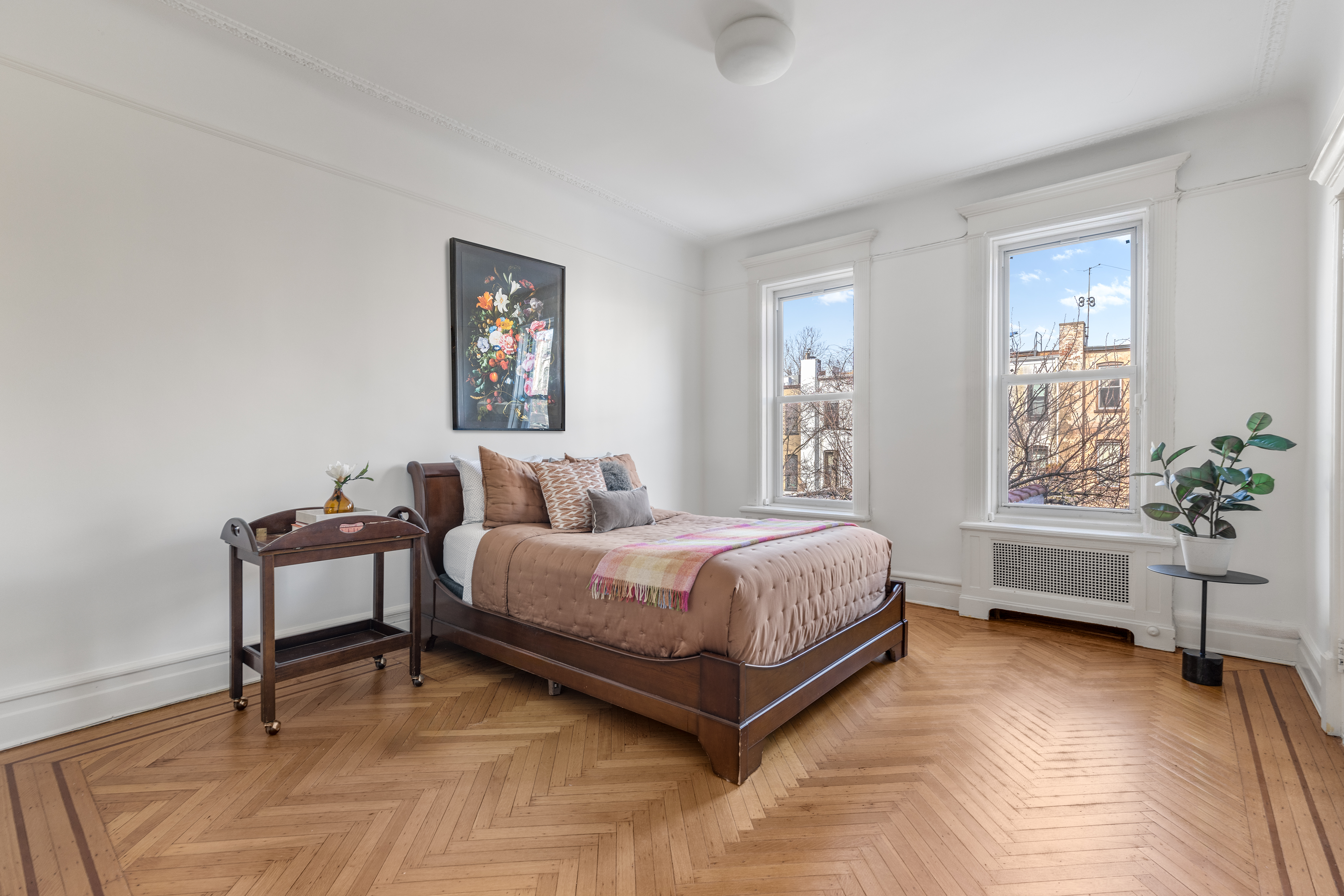 599 2nd Street Brooklyn, NY 11215 - Photo 10 of 16 a spacious bedroom with a bed and a window