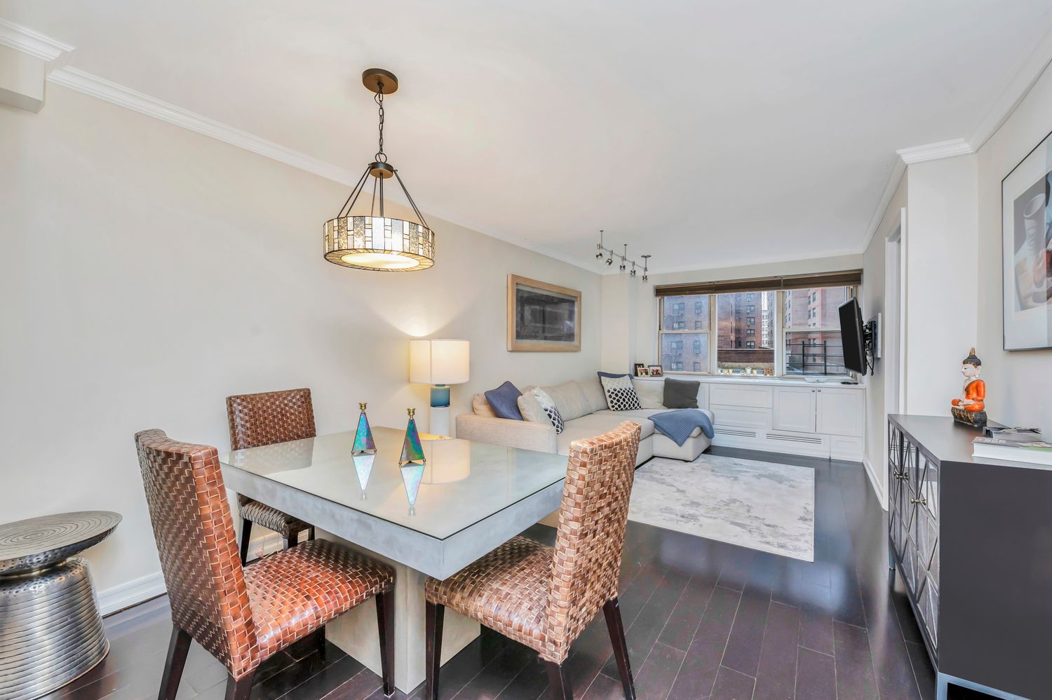 a view of a dining room with furniture window and wooden floor