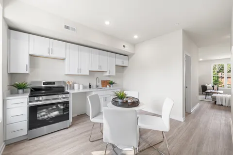 a bathroom with a bathtub toilet sink and mirror