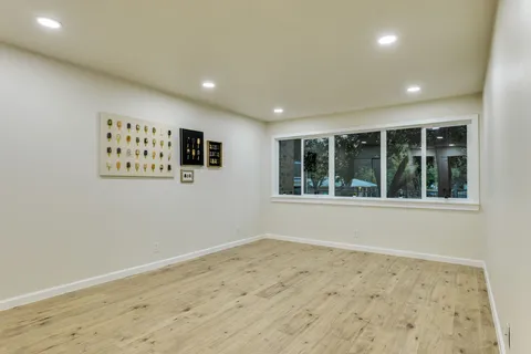 a view of an empty room with a window