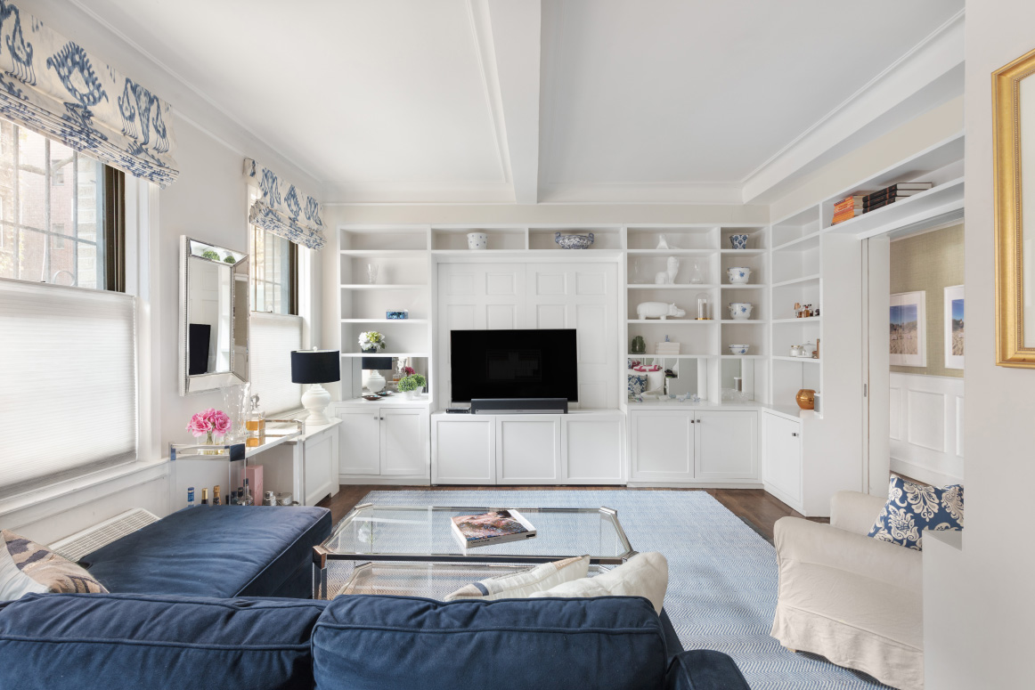 130 East 94th Street, Unit 1A Manhattan, NY 10128 - Photo 2 of 11 a living room with furniture and a flat screen tv
