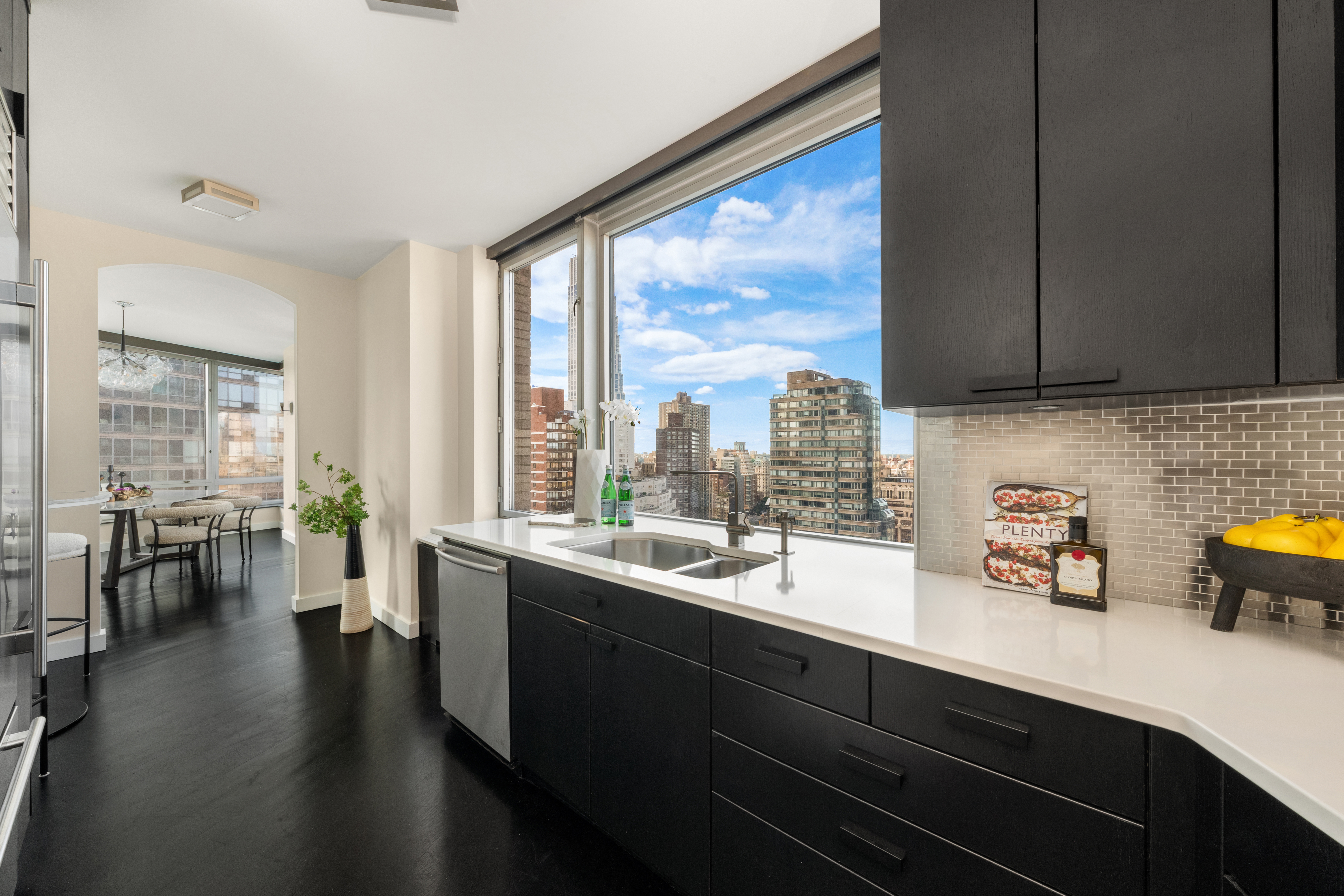 150 Columbus Avenue, Unit 22A Manhattan, NY 10023 - Photo 5 of 23 a kitchen with a sink and wooden floor