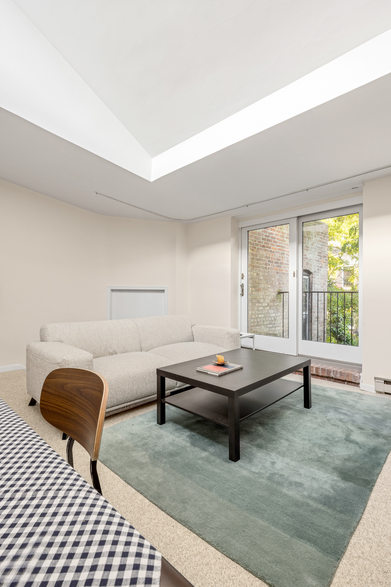 342 West 22nd Street, Unit 3 Manhattan, NY 10011 - Photo 2 of 11 a living room with furniture a table and next to a window