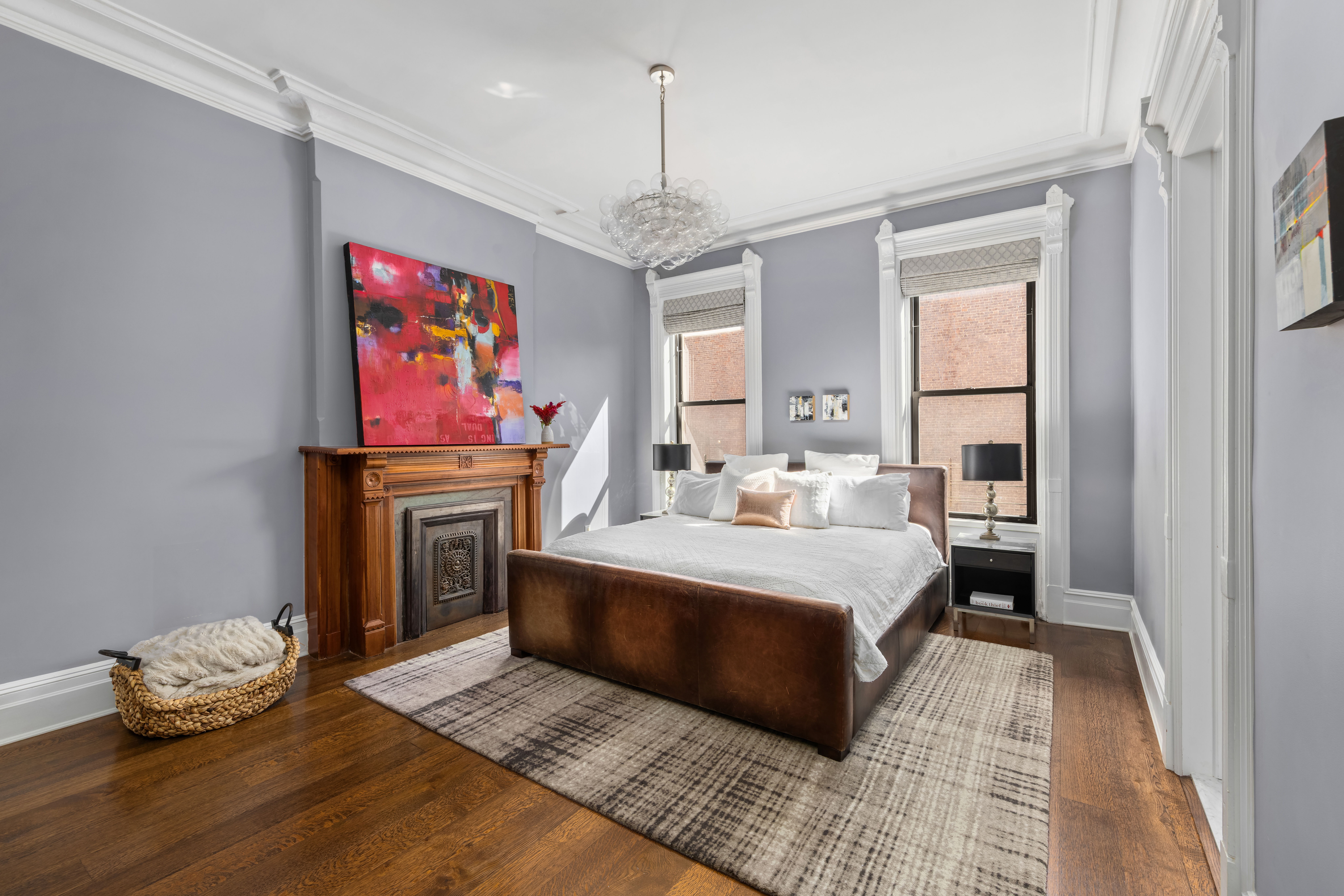 159 6th Avenue, Unit TRIPLEX Brooklyn, NY 11217 - Photo 6 of 19 a spacious bedroom with a bed and a chandelier