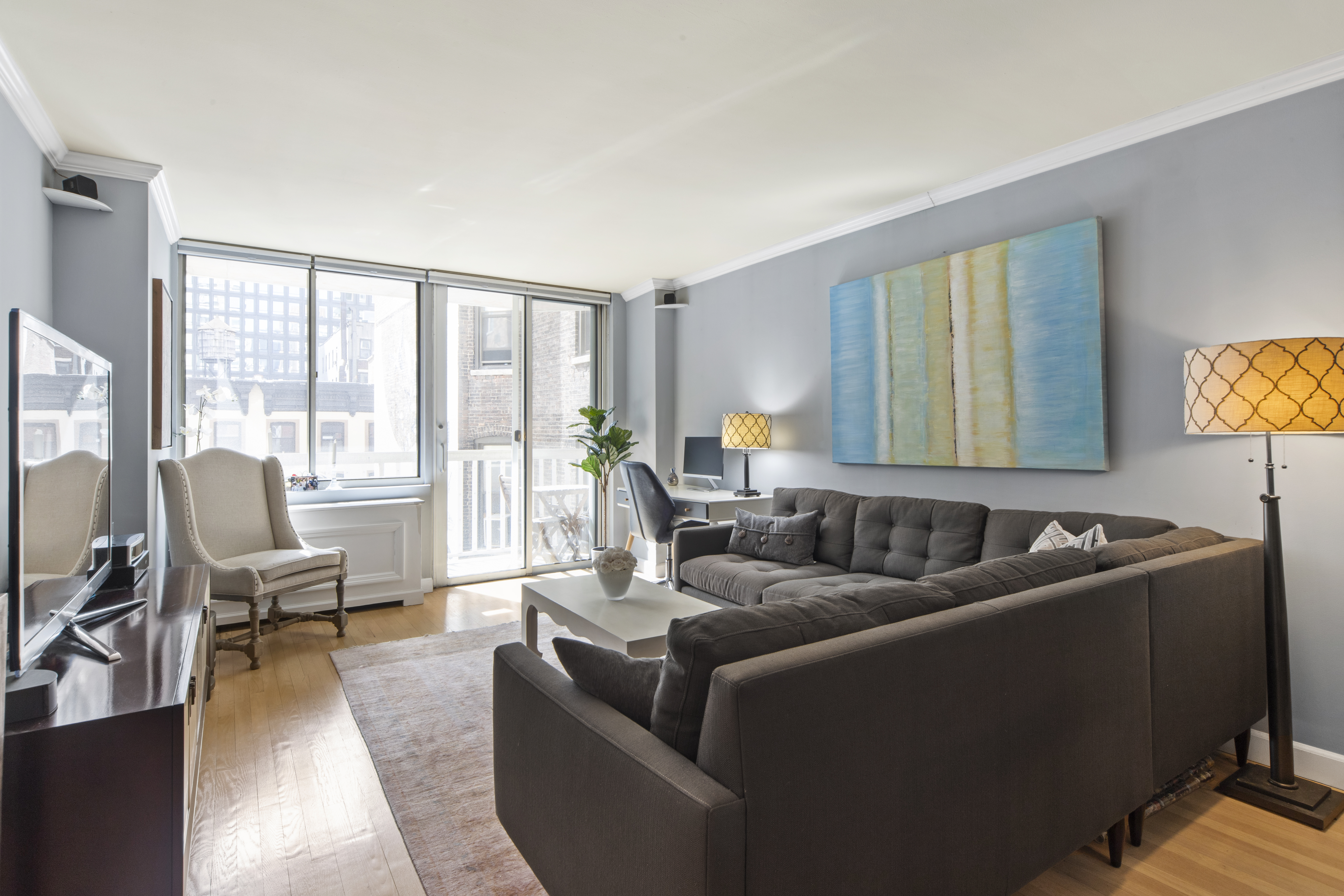 a living room with furniture and a large window