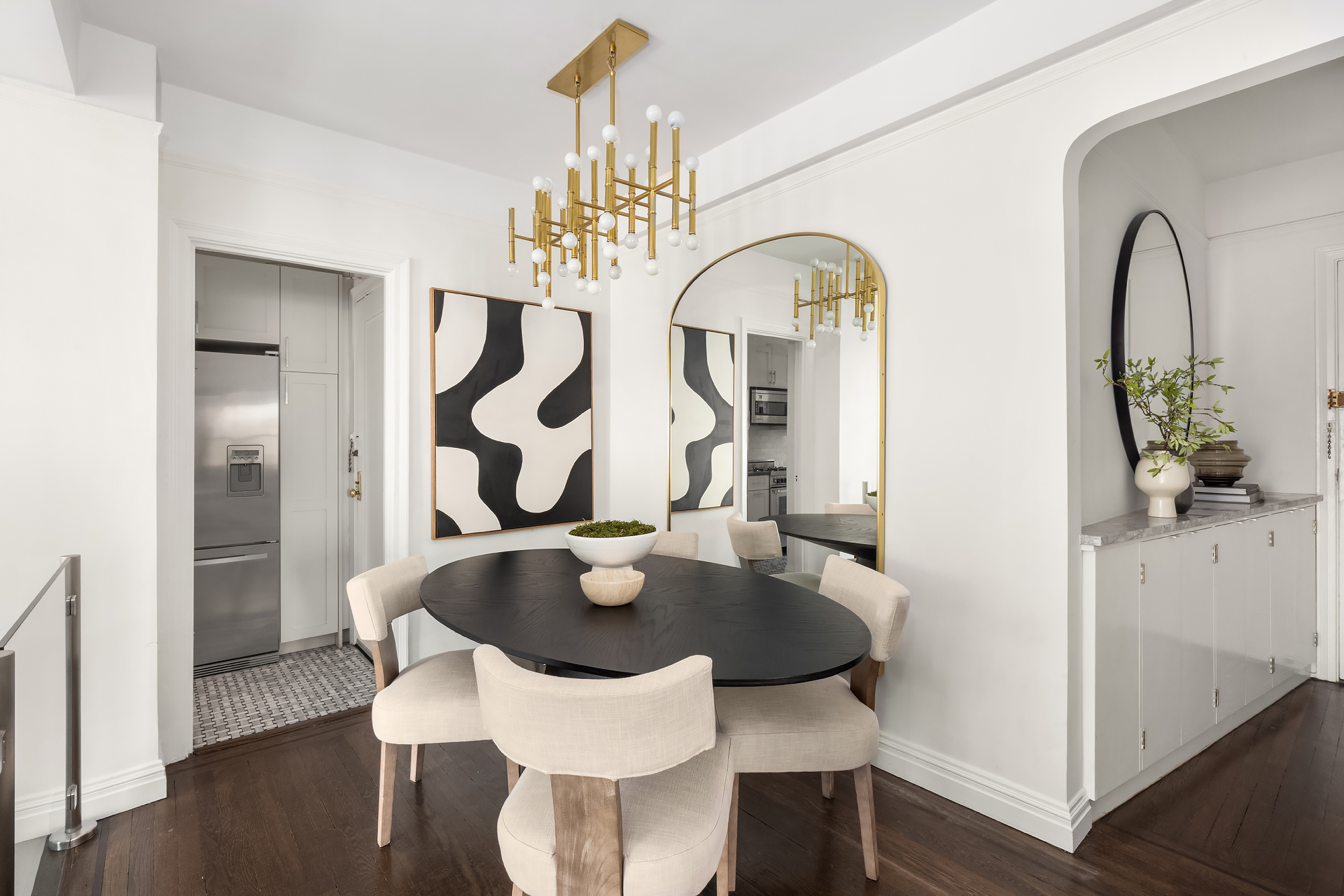 49 East 96th Street, Unit 9B Manhattan, NY 10128 - Photo 6 of 15 a view of a dining room with furniture and wooden floor