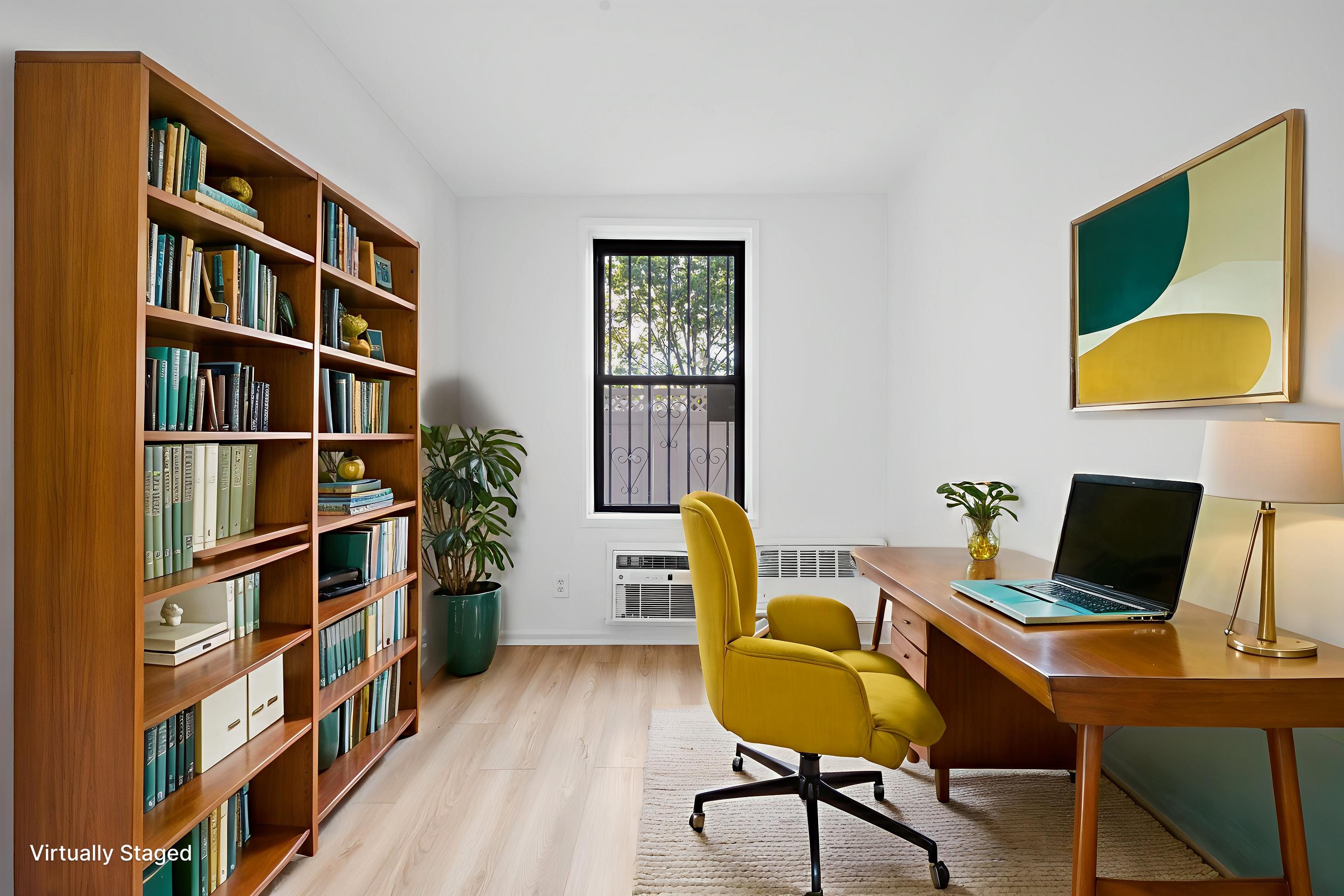 35-20 Leverich Street, Unit B226 Queens, NY 11372 - Photo 9 of 15 a view of a workspace with furniture and a bookshelf
