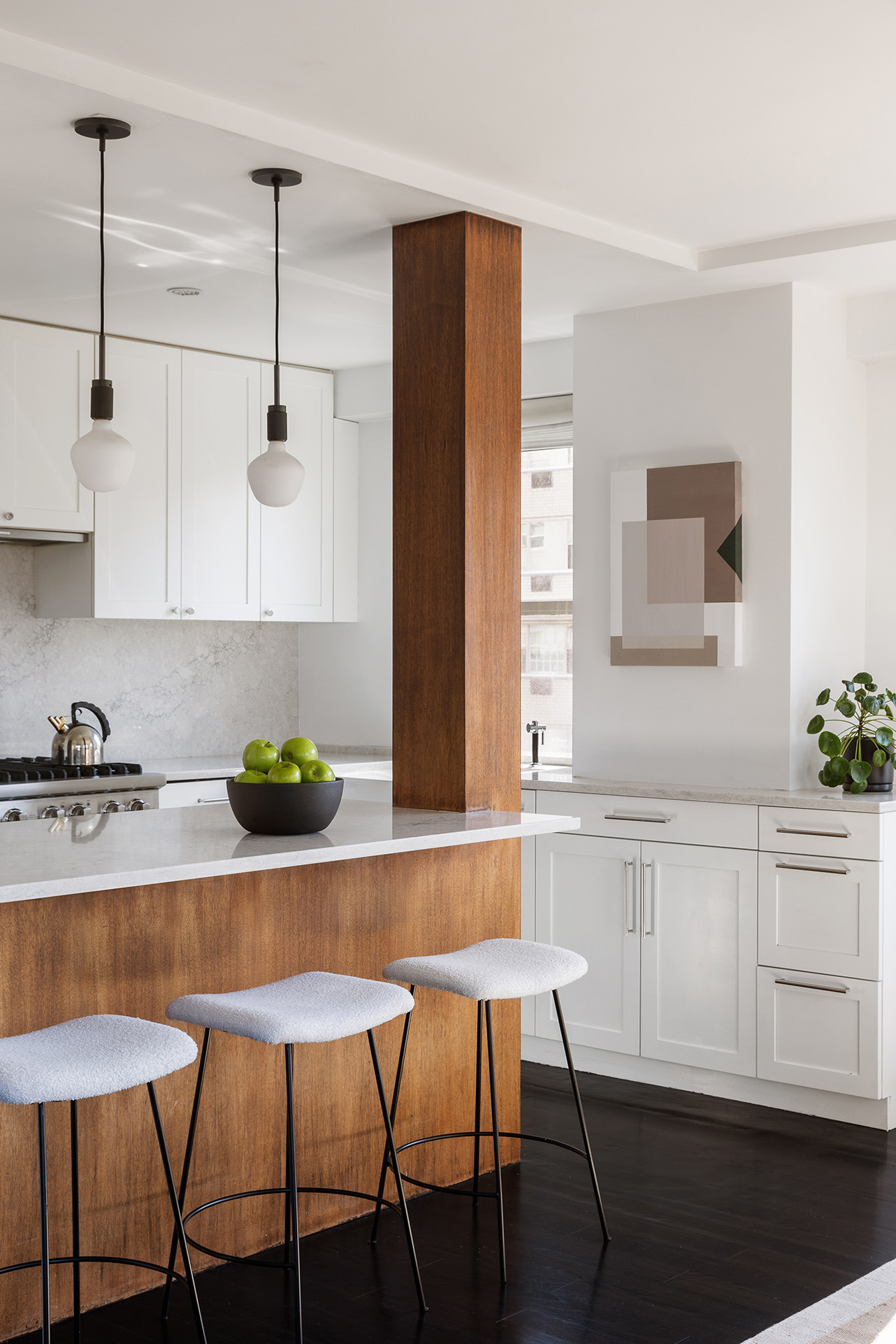 101 West 12th Street, Unit 8RS Manhattan, NY 10011 - Photo 6 of 19 a kitchen with a dining table chairs and cabinets
