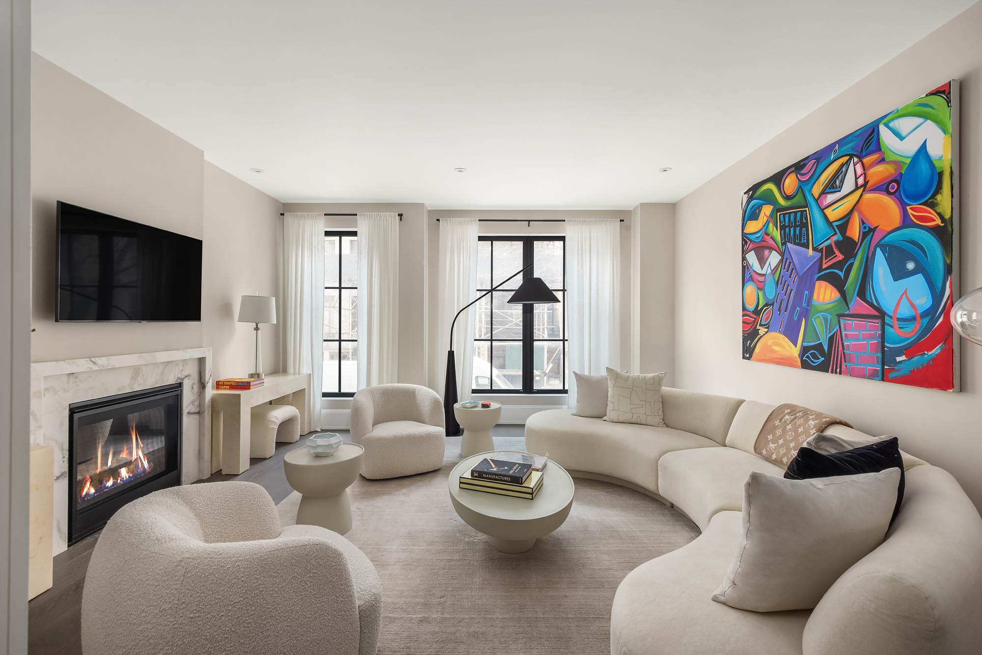 123 East 61st Street Manhattan, NY 10065 - Photo 3 of 31 a living room with fireplace furniture and a flat screen tv