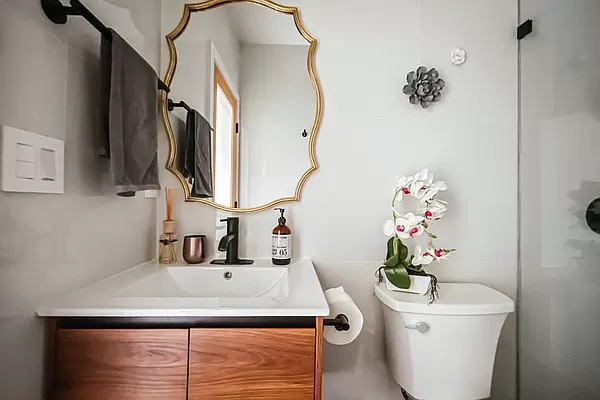334 Plymouth Street Brooklyn, NY 11201 - Photo 25 of 32 a bathroom with a sink a toilet and mirror