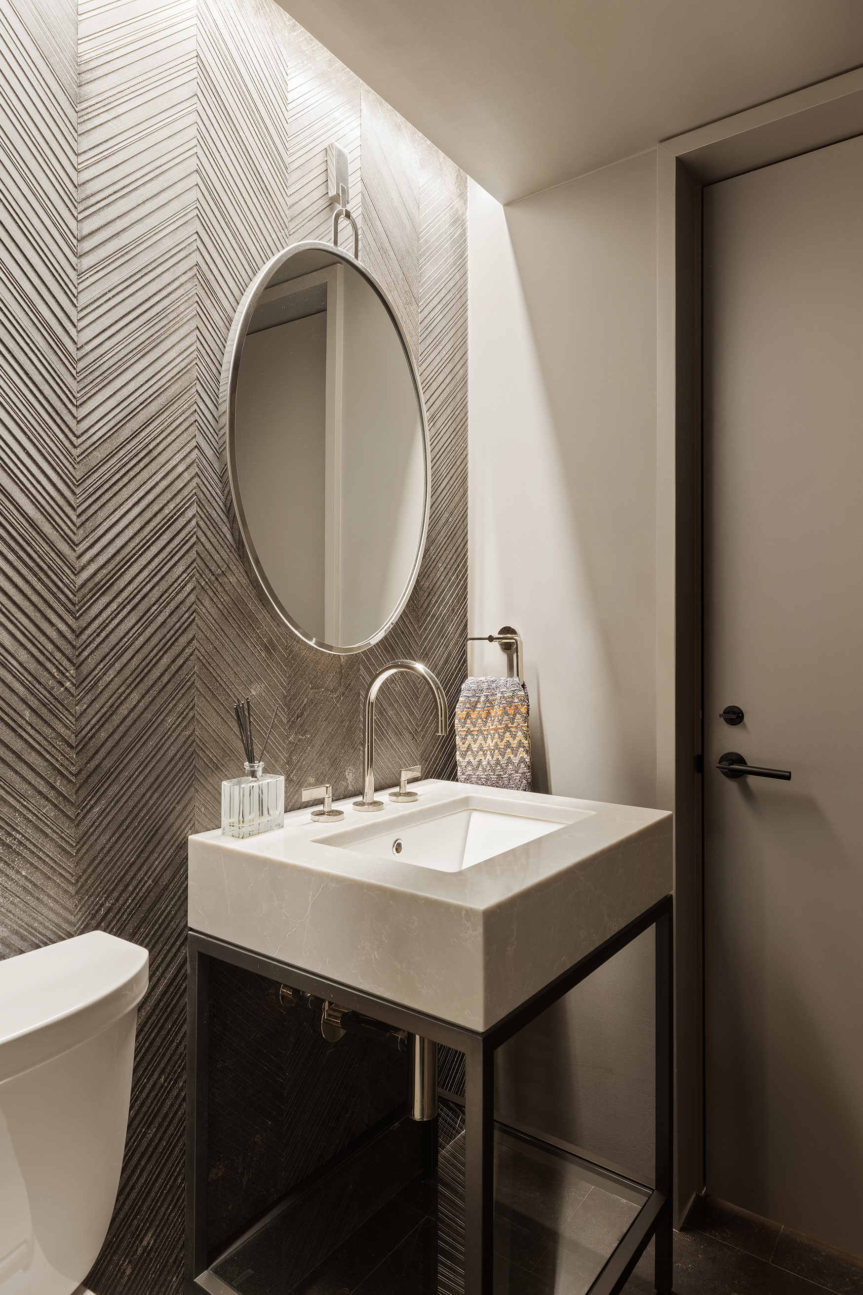 129 West 20th Street, Unit 4B Manhattan, NY 10011 - Photo 15 of 16 a bathroom with a sink a toilet and a mirror