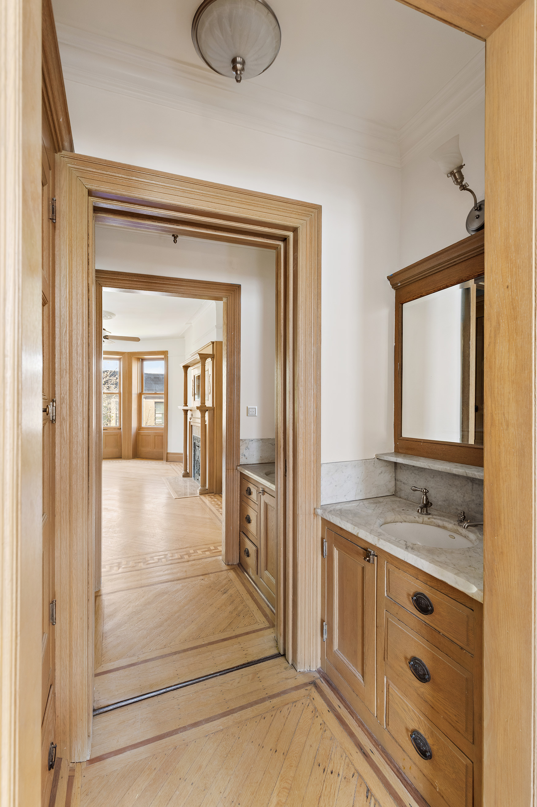 608 2nd Street Brooklyn, NY 11215 - Photo 29 of 34 a bathroom with a granite countertop sink mirror and vanity