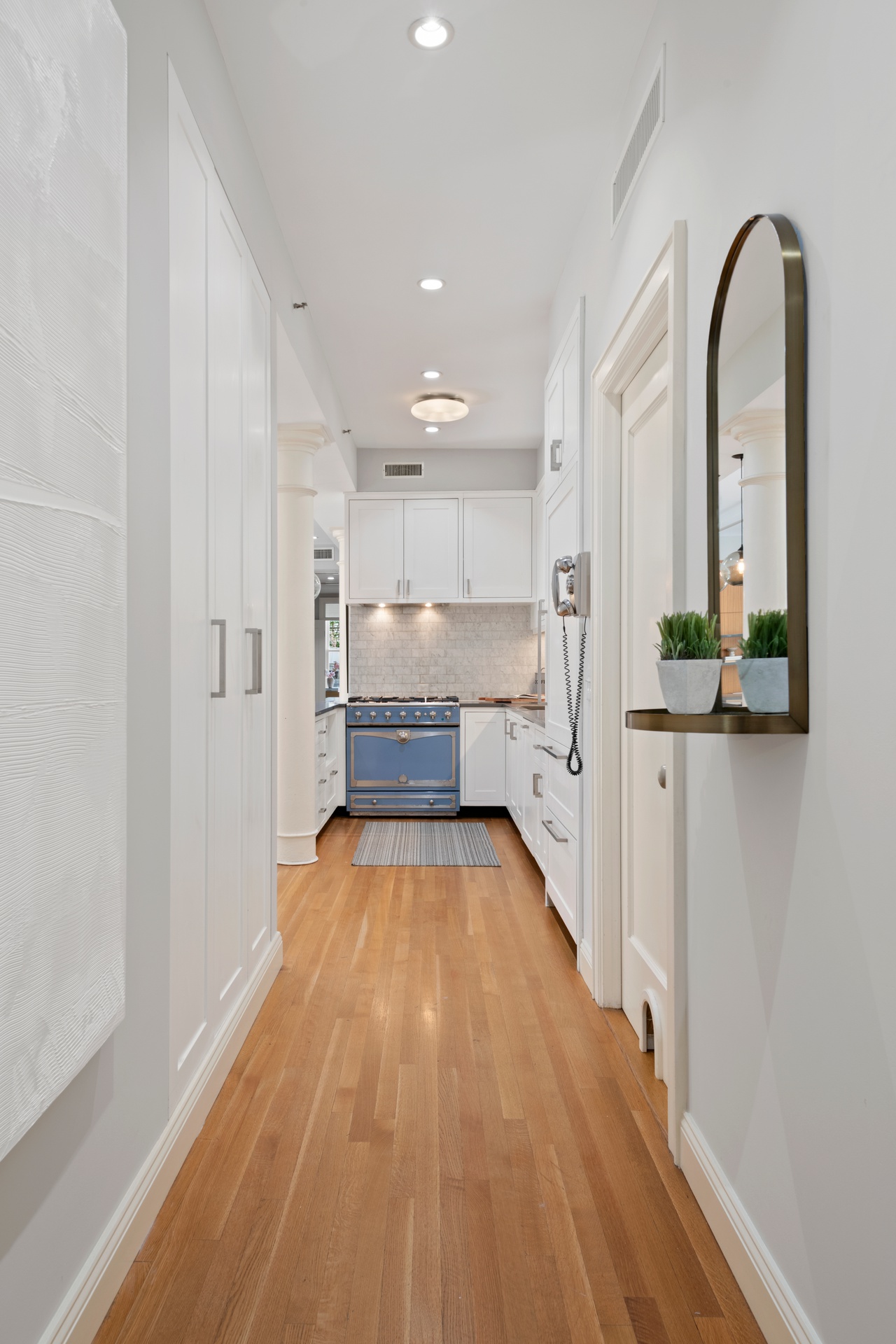 30 West 13th Street, Unit 4C Manhattan, NY 10011 - Photo 10 of 22 a view of a kitchen with a sink and refrigerator