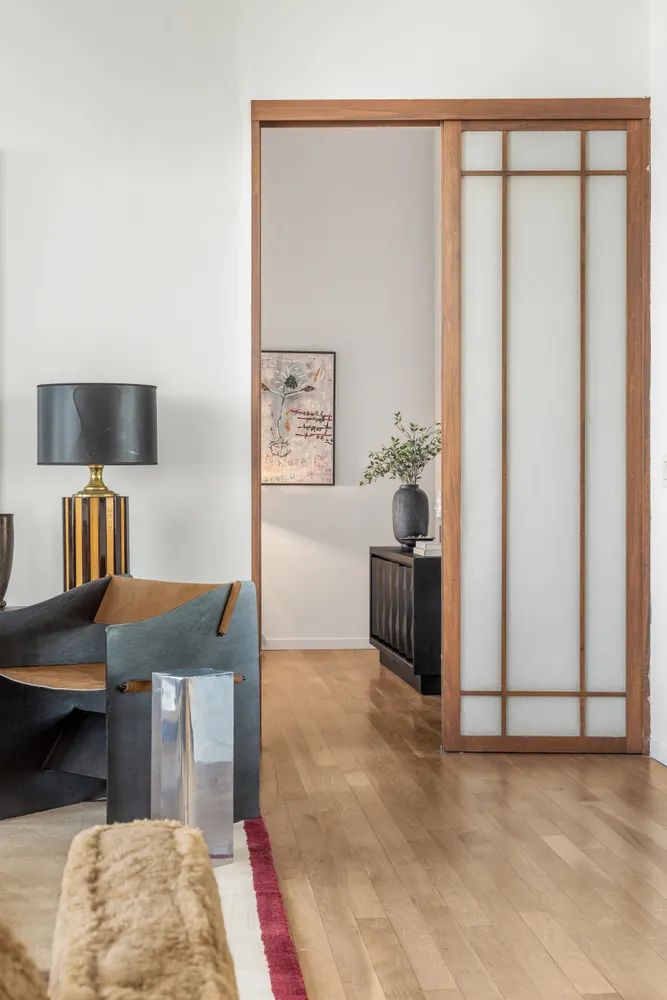 a living room with furniture and a rug