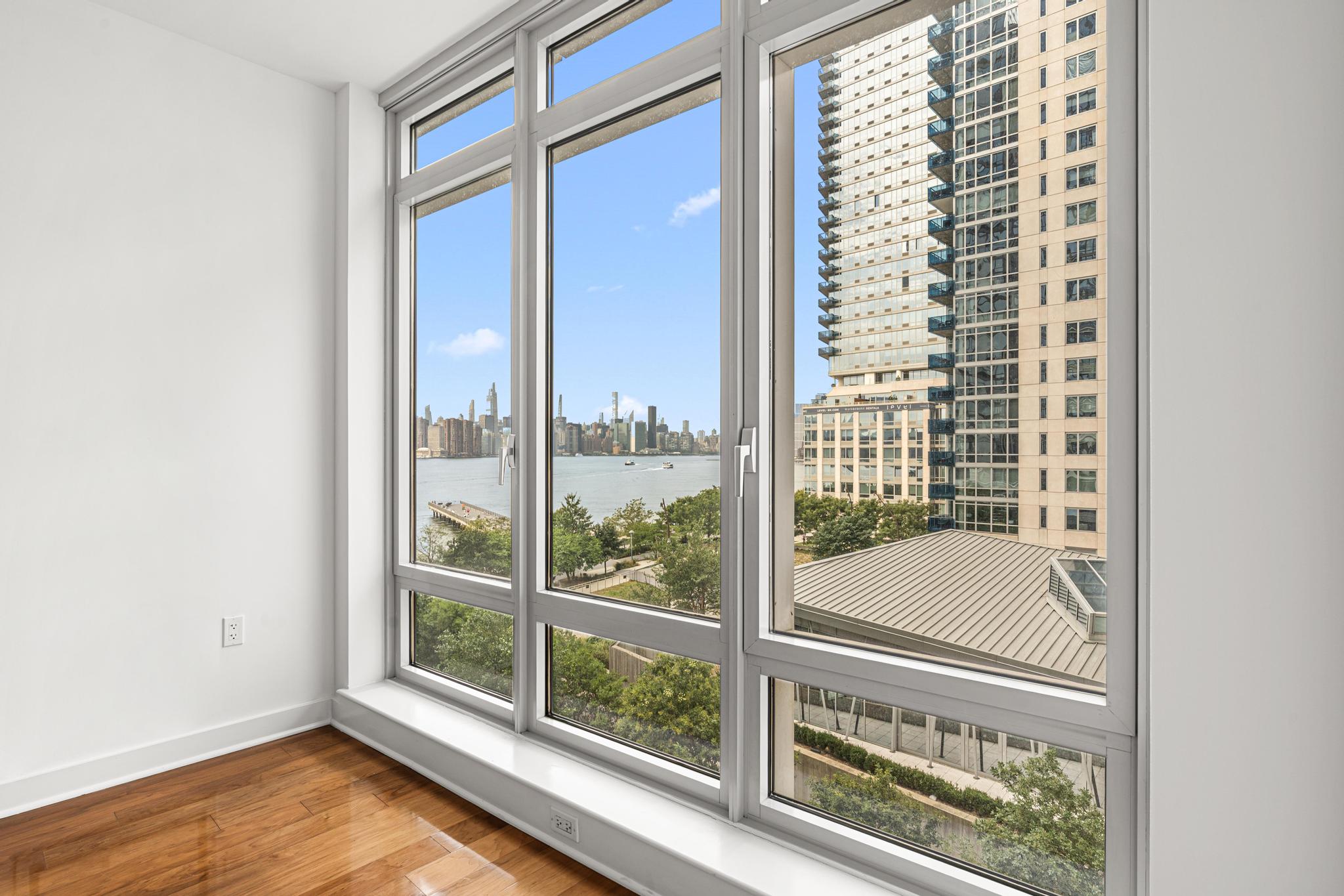 2 Northside Piers, Unit 5U Brooklyn, NY 11249 - Photo 5 of 12 a view of an empty room and window