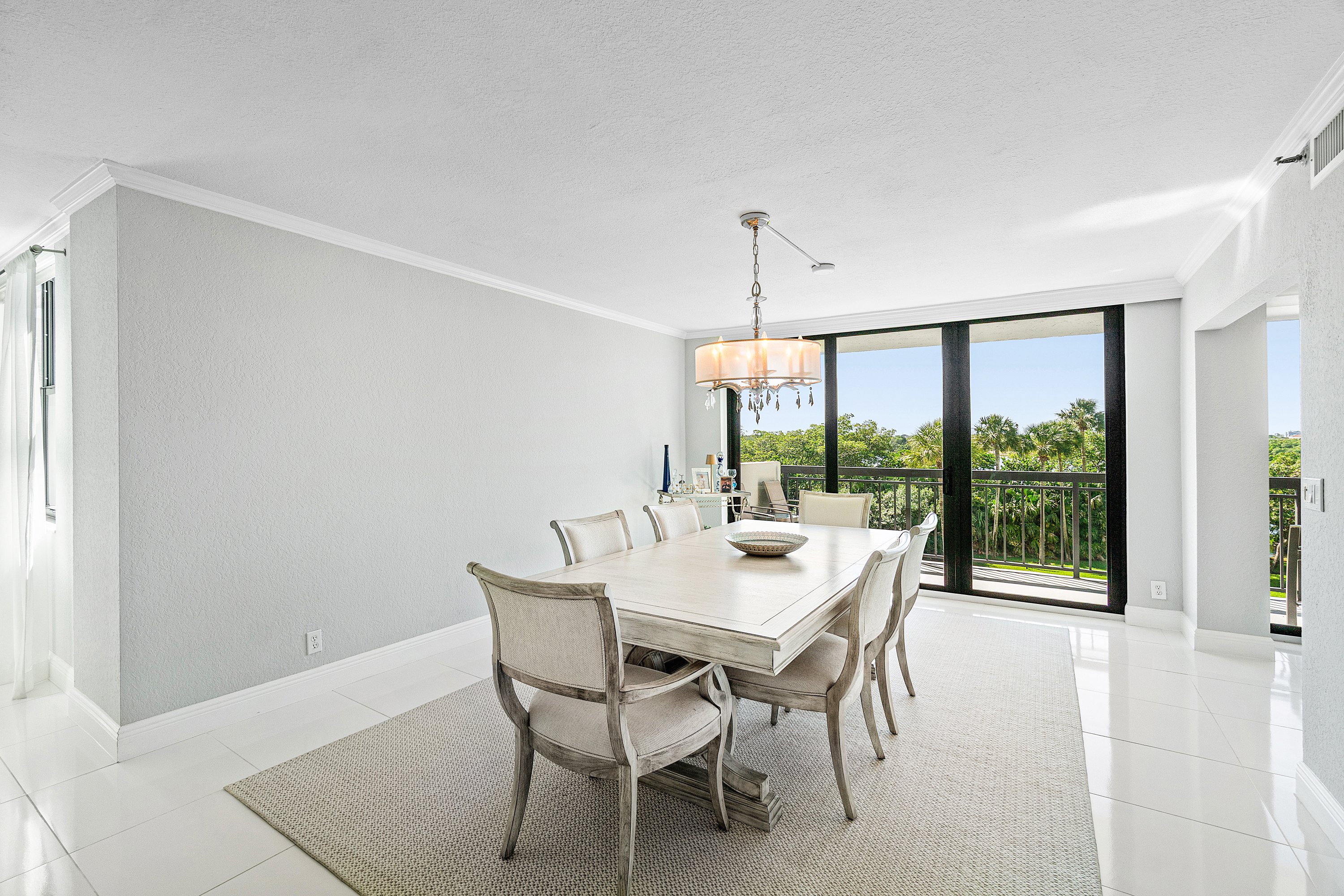 2003 North Ocean Boulevard, Unit 305 Boca Raton, FL 33431 - Photo 15 of 56 a view of a dining room with furniture window and outside view