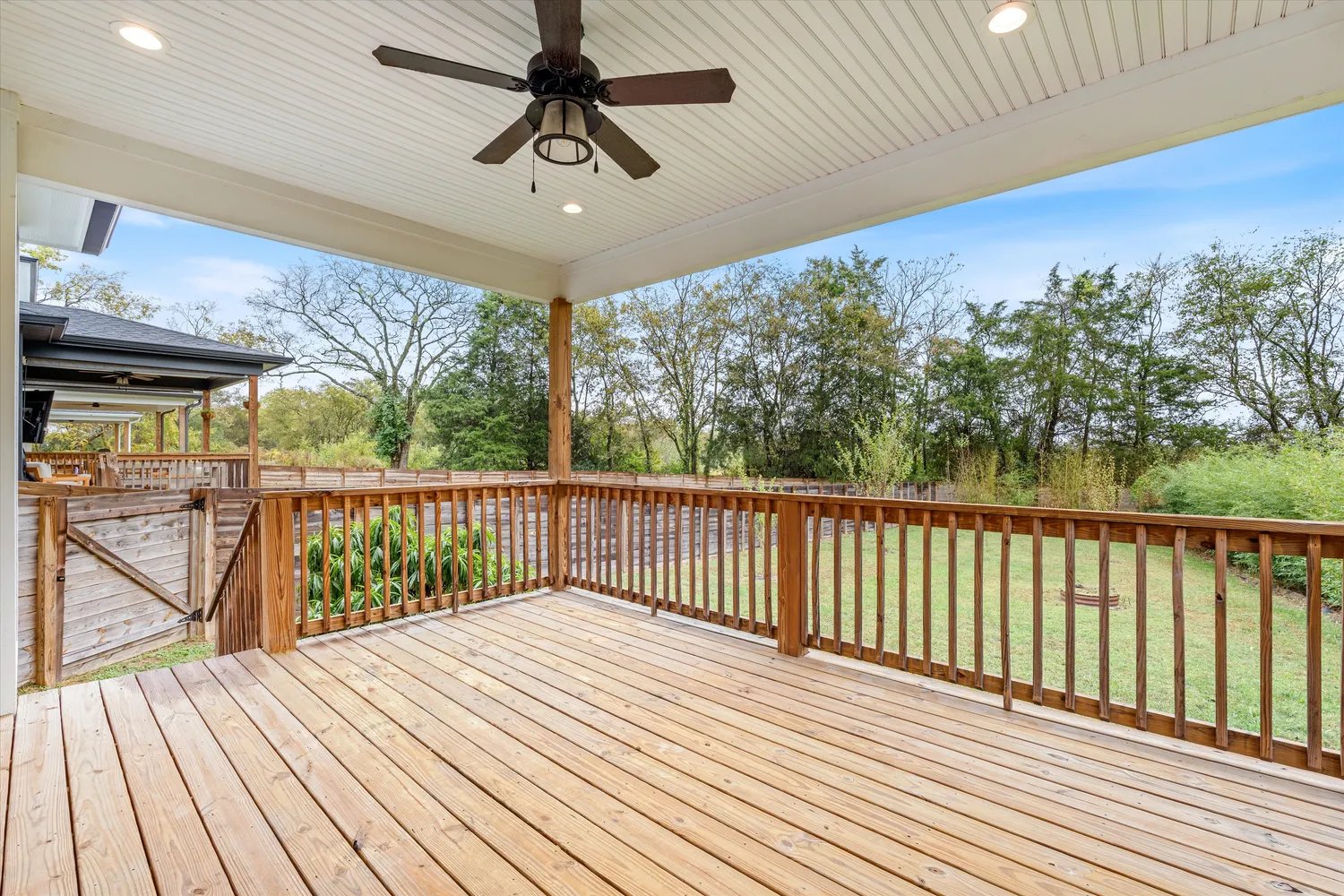 a view of balcony with wooden floor