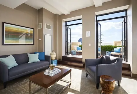 a living room with furniture and a large window