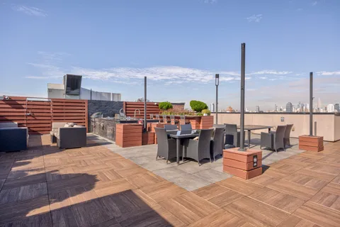 a living room filled with table and chairs