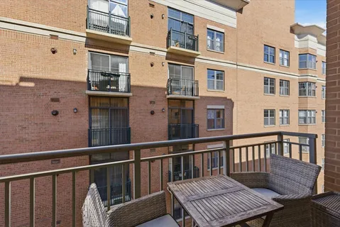 a view of a brick building from a balcony