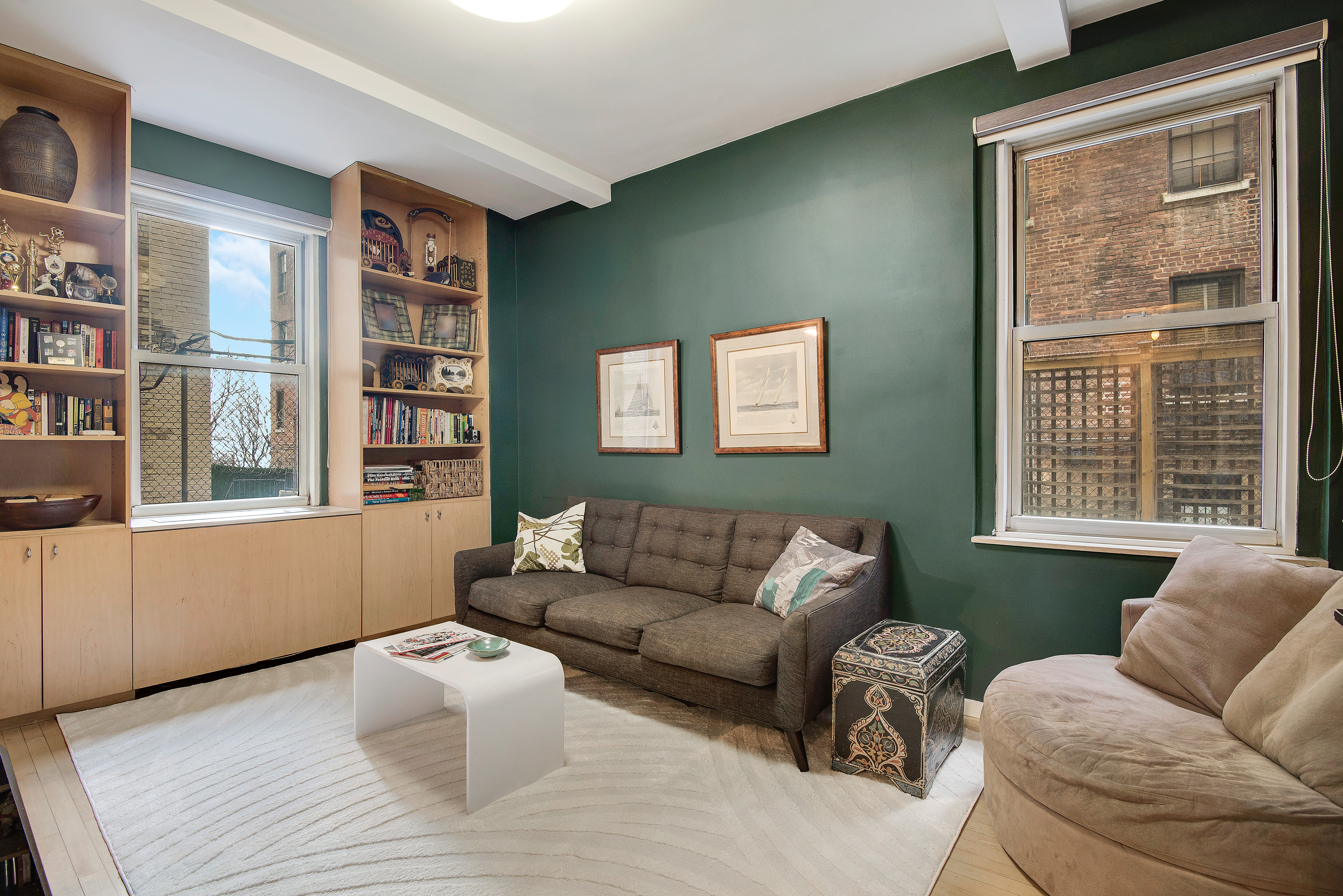 434 East 52nd Street, Unit 1BH Manhattan, NY 10022 - Photo 13 of 23 a living room with furniture and a window
