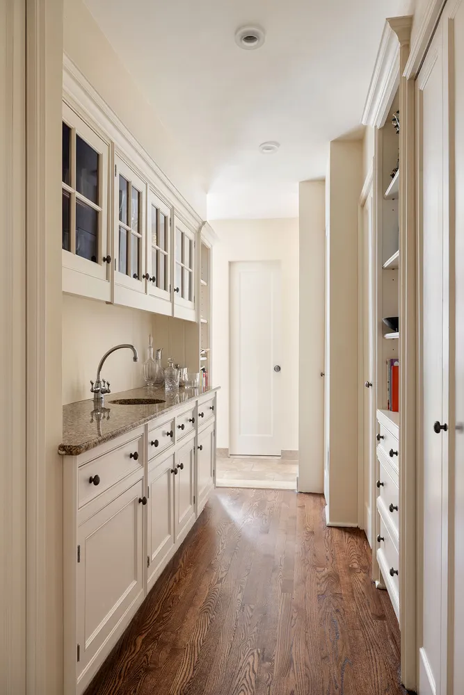 a spacious bathroom with a granite countertop sink a mirror and a shower