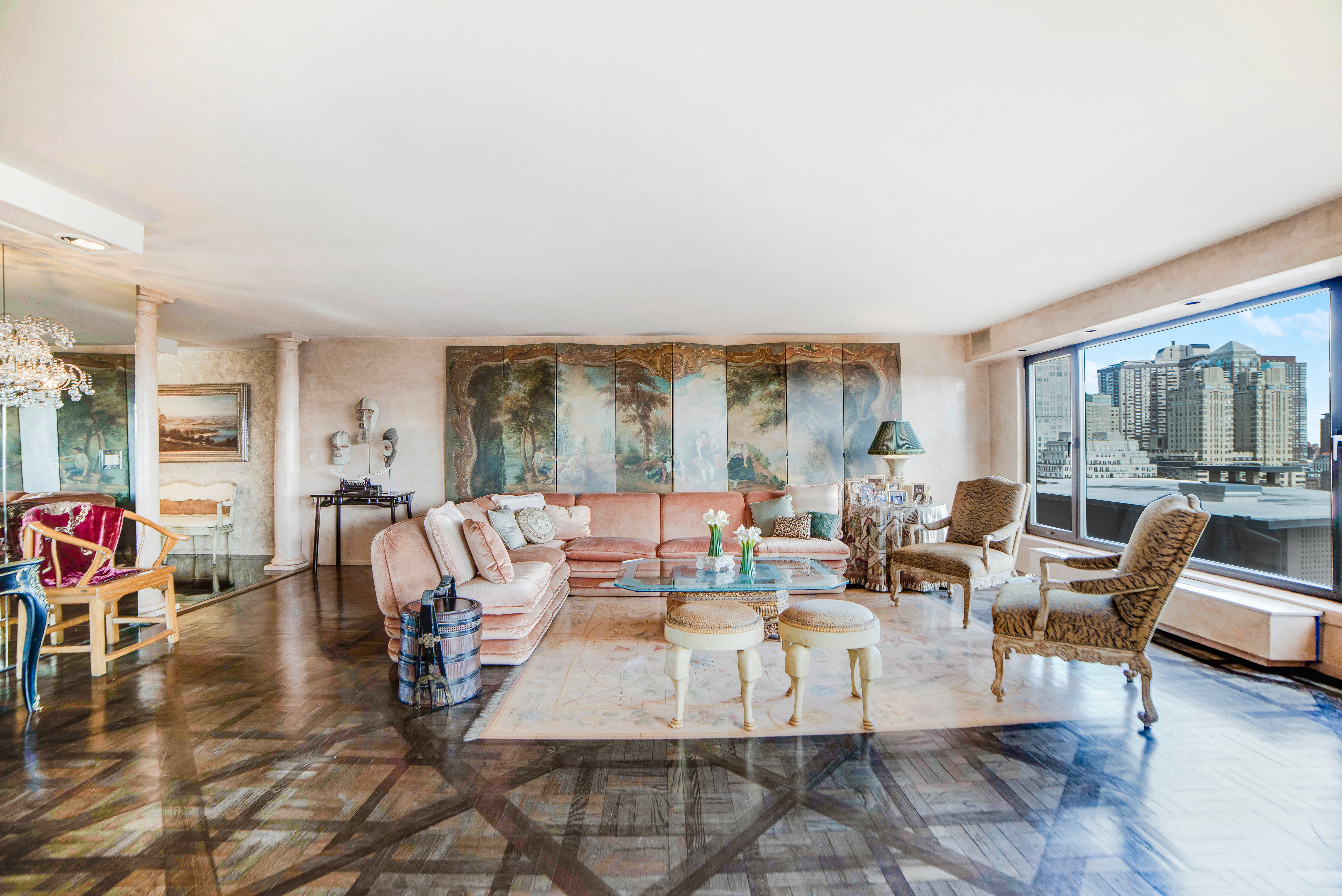 200 Central Park South, Unit 24A Manhattan, NY 10019 - Photo 3 of 23 a living room with furniture and a large window