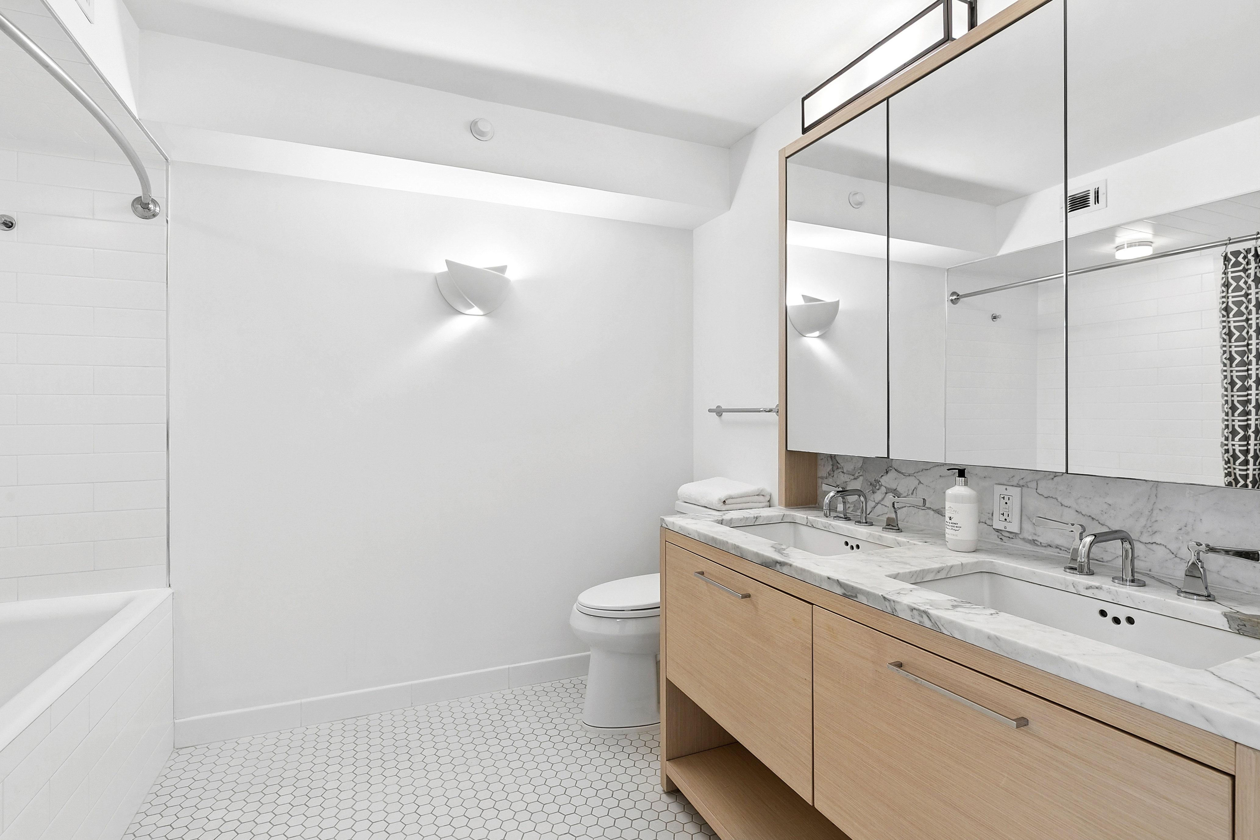 101 West 87th Street, Unit 505 Manhattan, NY 10024 - Photo 11 of 15 a bathroom with a sink a toilet and shower