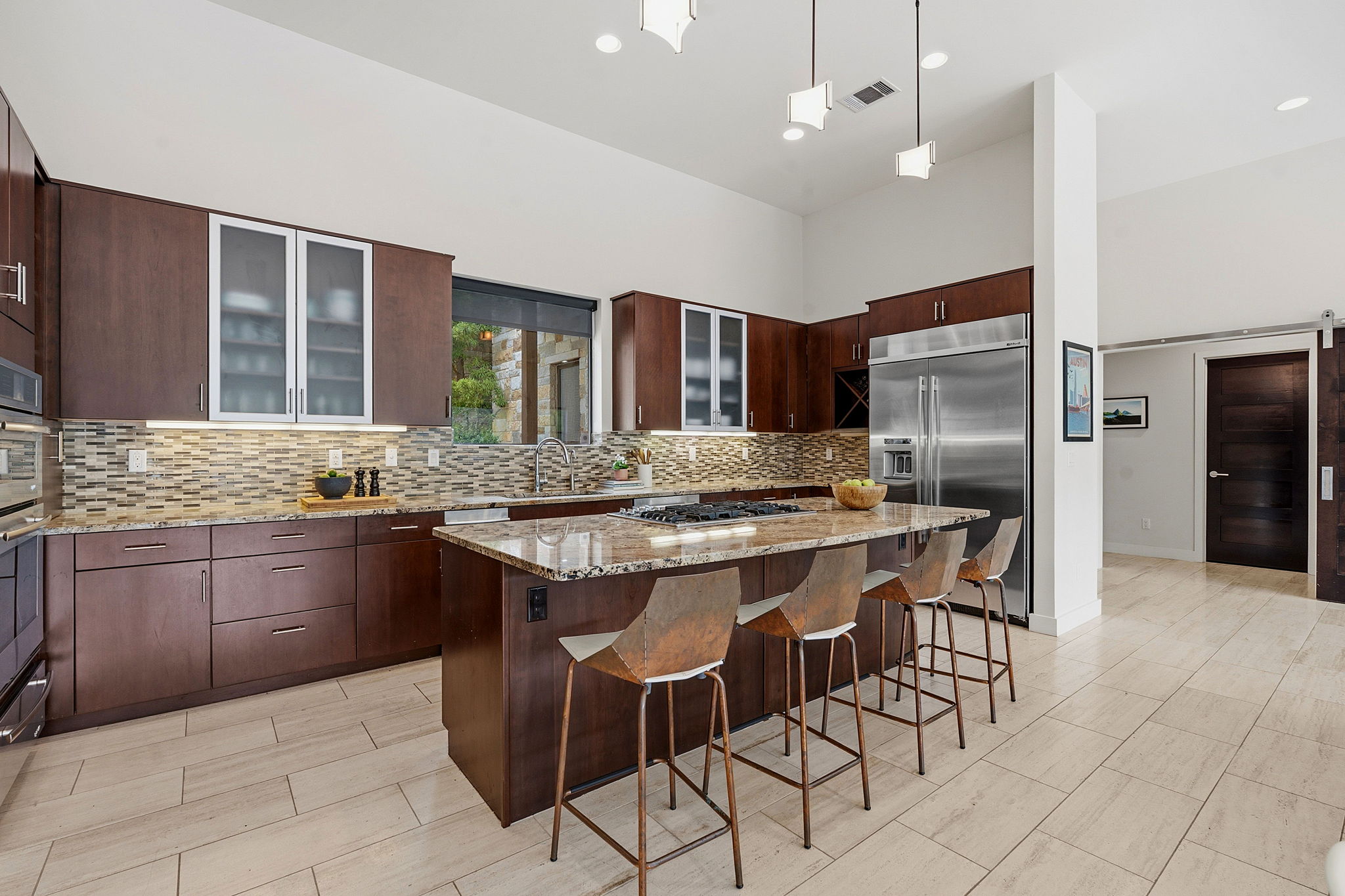 3605 Robbins Road Austin, TX 78730 - Photo 16 of 51 a kitchen with granite countertop stainless steel appliances a sink counter space and a center island