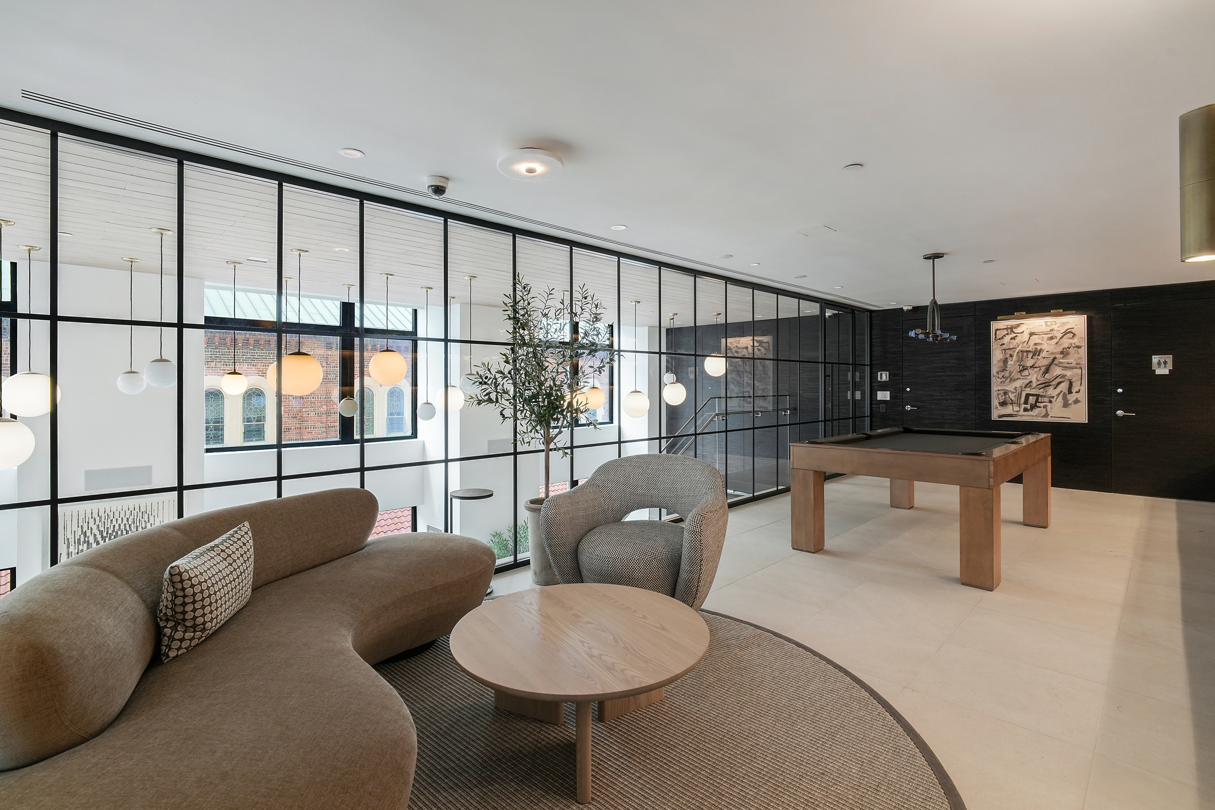 400 East 67th Street, Unit 7B Manhattan, NY 10065 - Photo 11 of 14 a living room with furniture and a potted plant