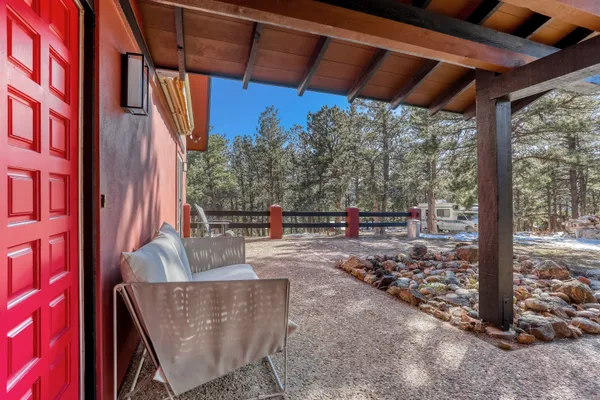 a bathroom with a bathtub and next to a window