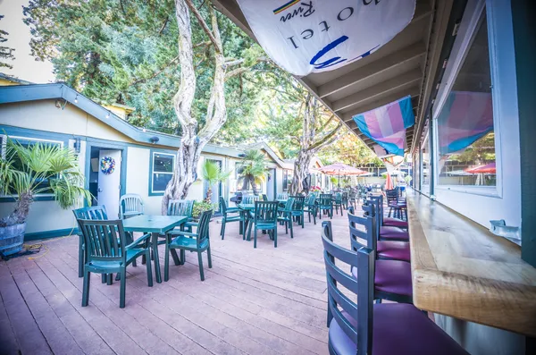 a view of a dining room with furniture water view and balcony