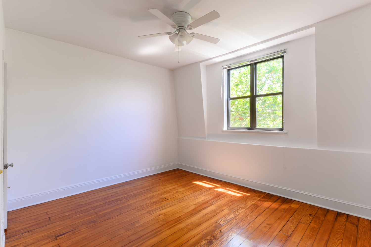 20 Strong Place Brooklyn, NY 11231 - Photo 18 of 21 an empty room with a window and wooden floor