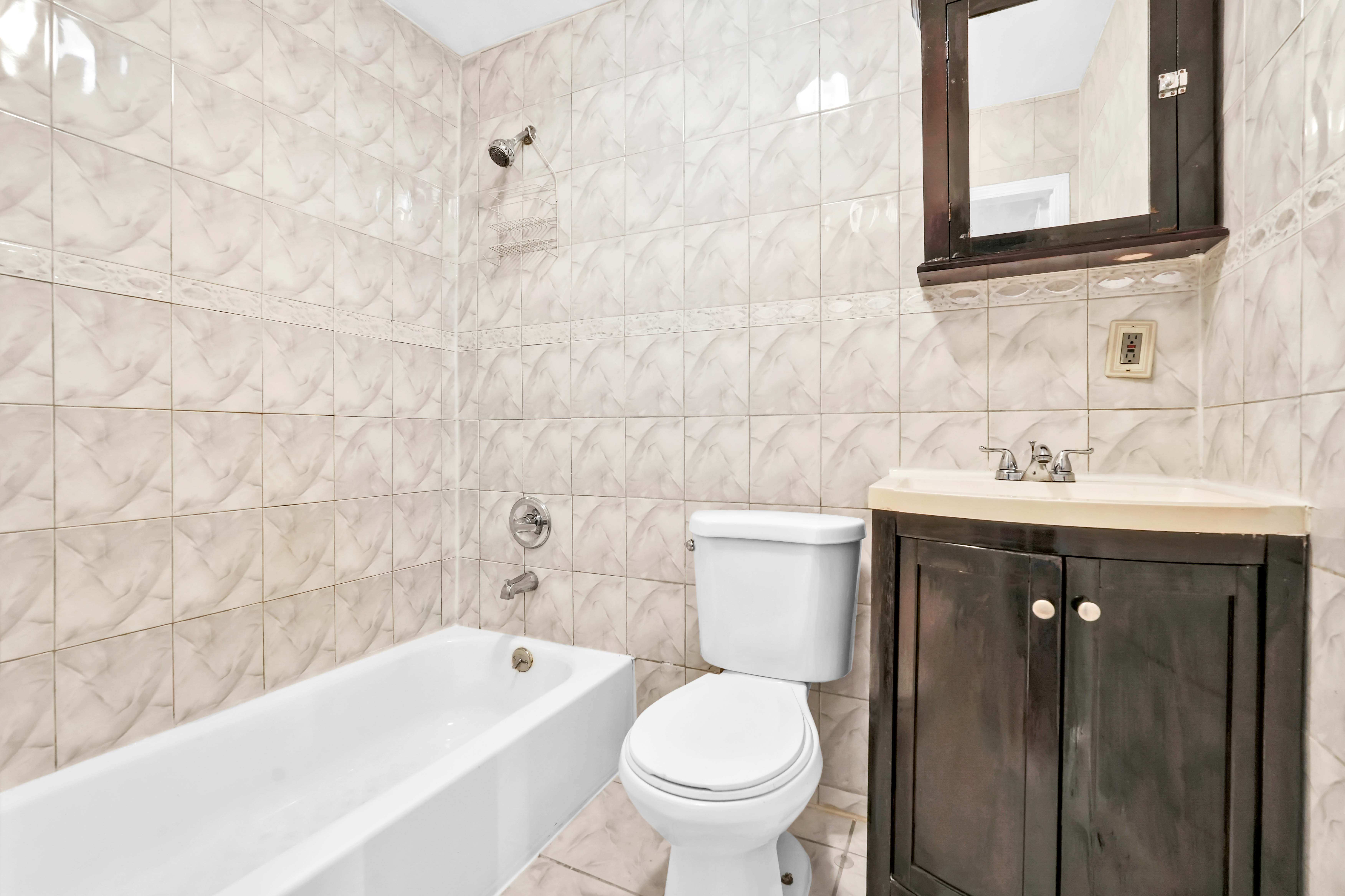 1633 St Johns Place, Unit 3 Brooklyn, NY 11233 - Photo 24 of 29 a bathroom with a sink toilet and shower