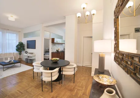 a living room with furniture and a table