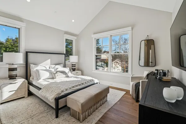 a bathroom with a sink a toilet a shower and a mirror