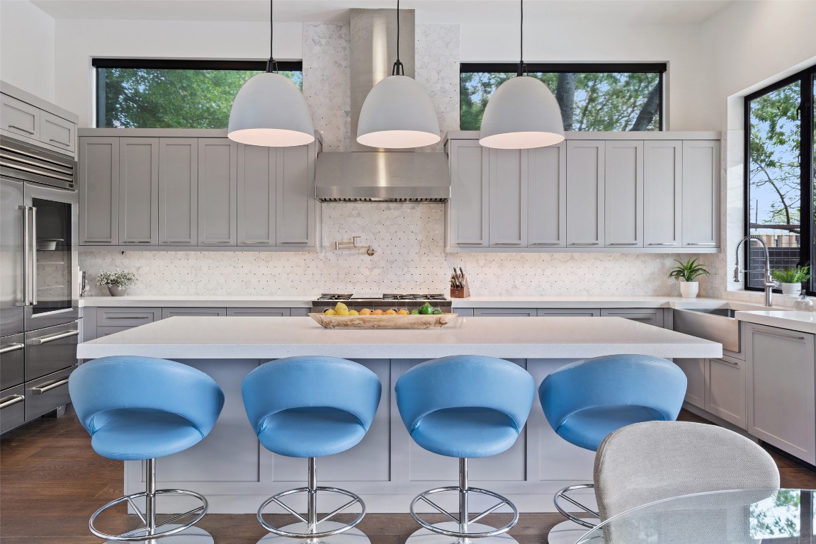 1207 East 13th Street Austin, TX 78702 - Photo 13 of 39 a kitchen with a table chairs stove and cabinets