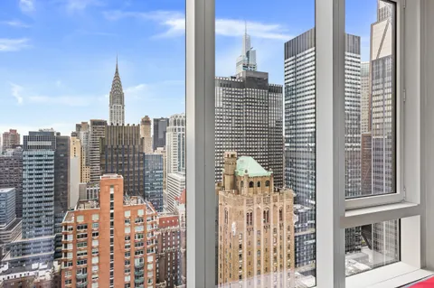 a view of city with tall buildings