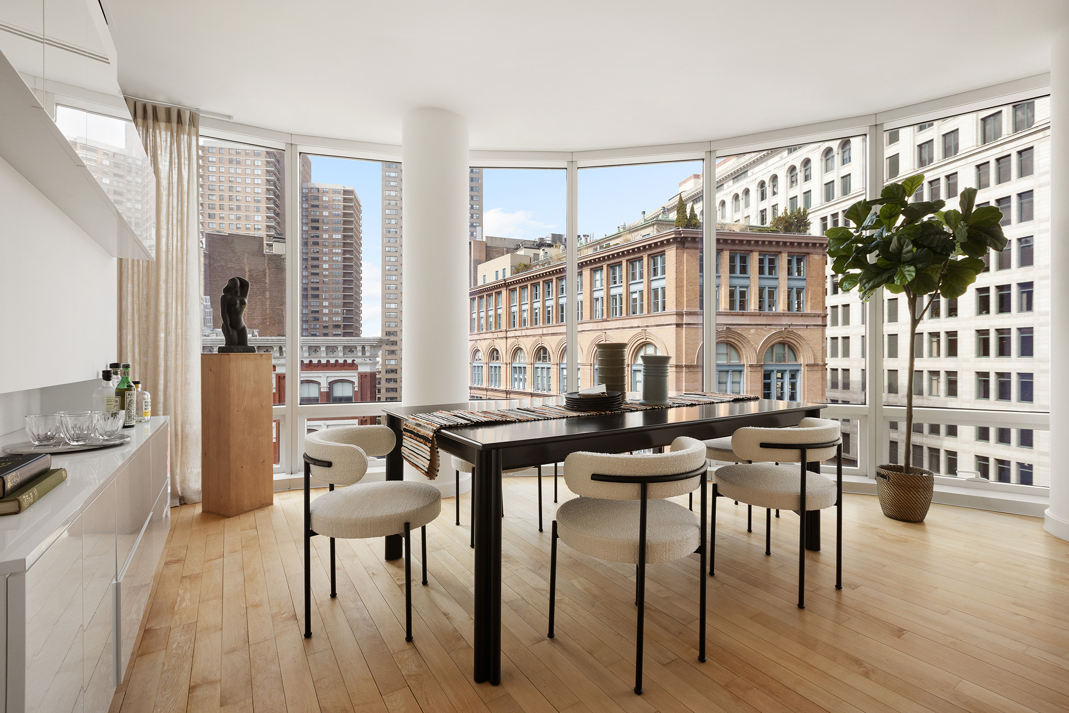 445 Lafayette Street, Unit 9C Manhattan, NY 10003 - Photo 2 of 10 a view of a dining room with furniture window and wooden floor