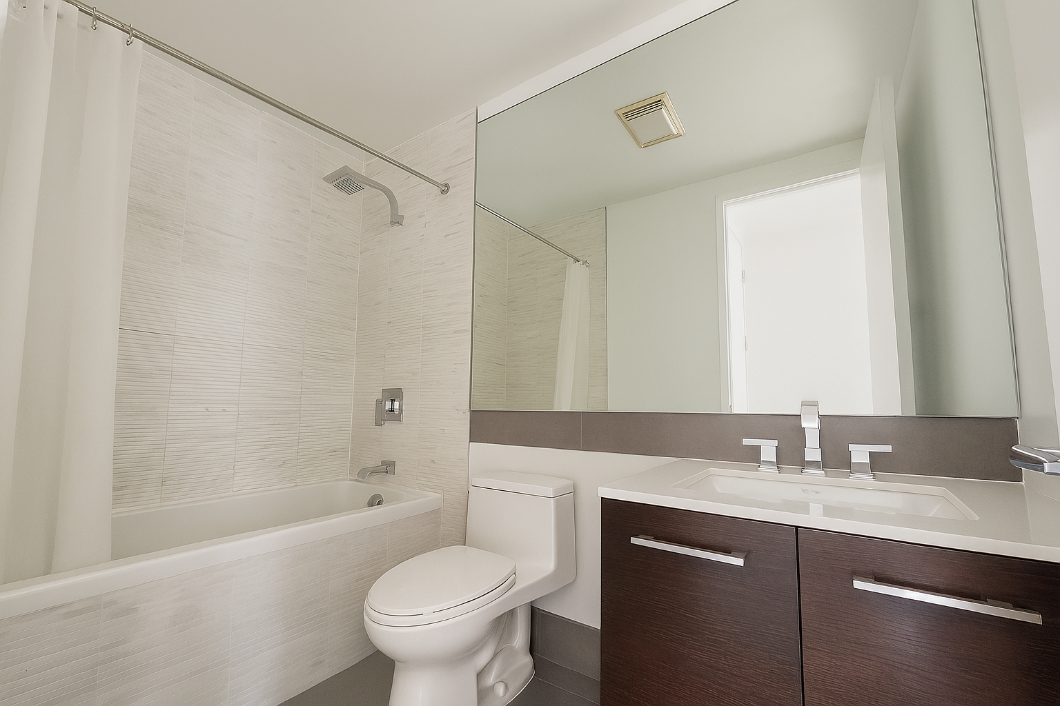 140 Degraw Street, Unit 4B Brooklyn, NY 11231 - Photo 4 of 8 a bathroom with a granite countertop sink toilet and shower